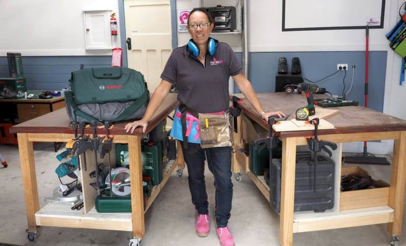 Kim Halbert-Pere poses in her workshop