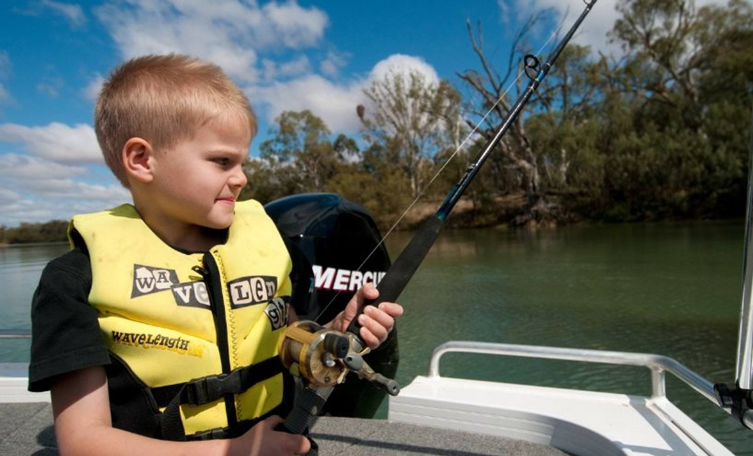 Child fishing in a boat