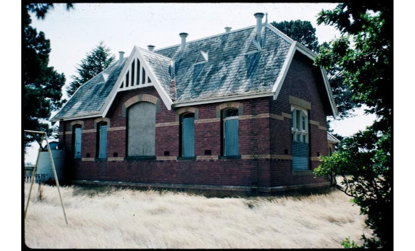 Former Carlsruhe State School with boarded up windows in 1970.