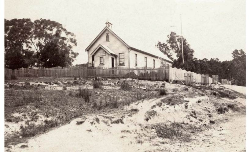 Former Golden Point State School timber building with picket fence around 1907.