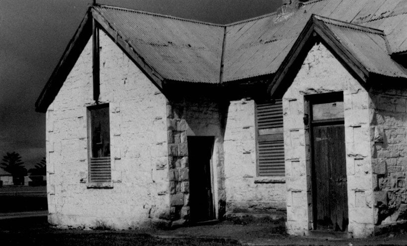 Black and white photograph of the Koroit stone school building. 