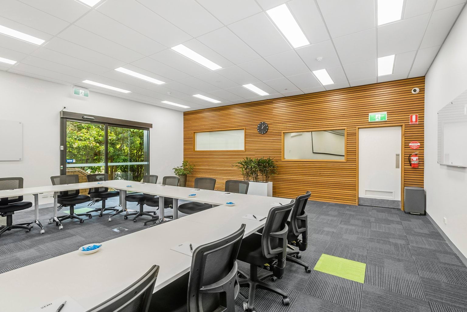 Image shows a meeting room at the VEMI Conference Centre with tables and chairs.