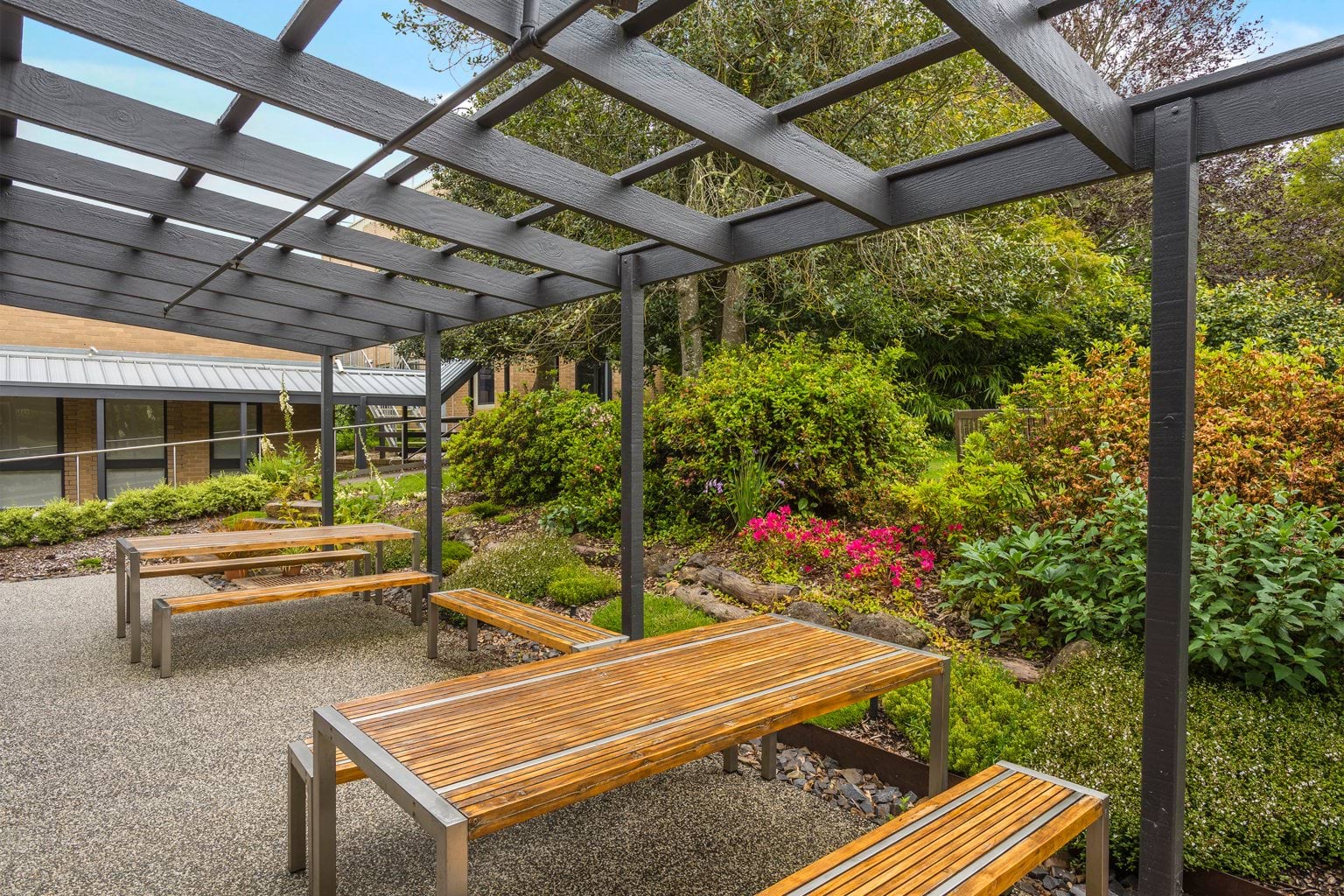 VEMI alfresco dining area showing outdoor tables and a canope
