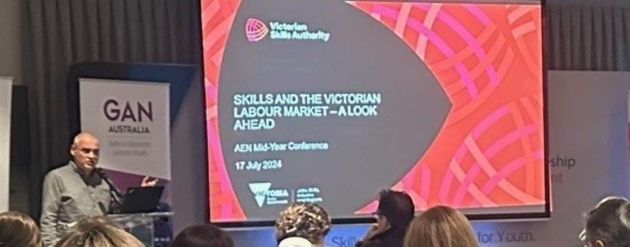 Person presenting at a conference