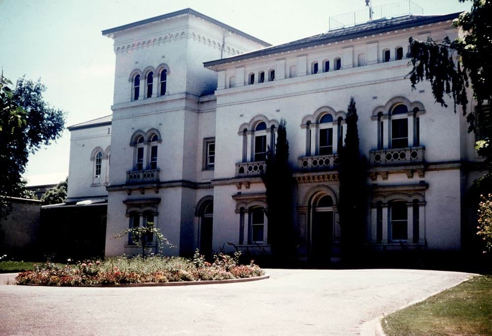 Beechworth Asylum colour shot of front office from the outside with rose bed
