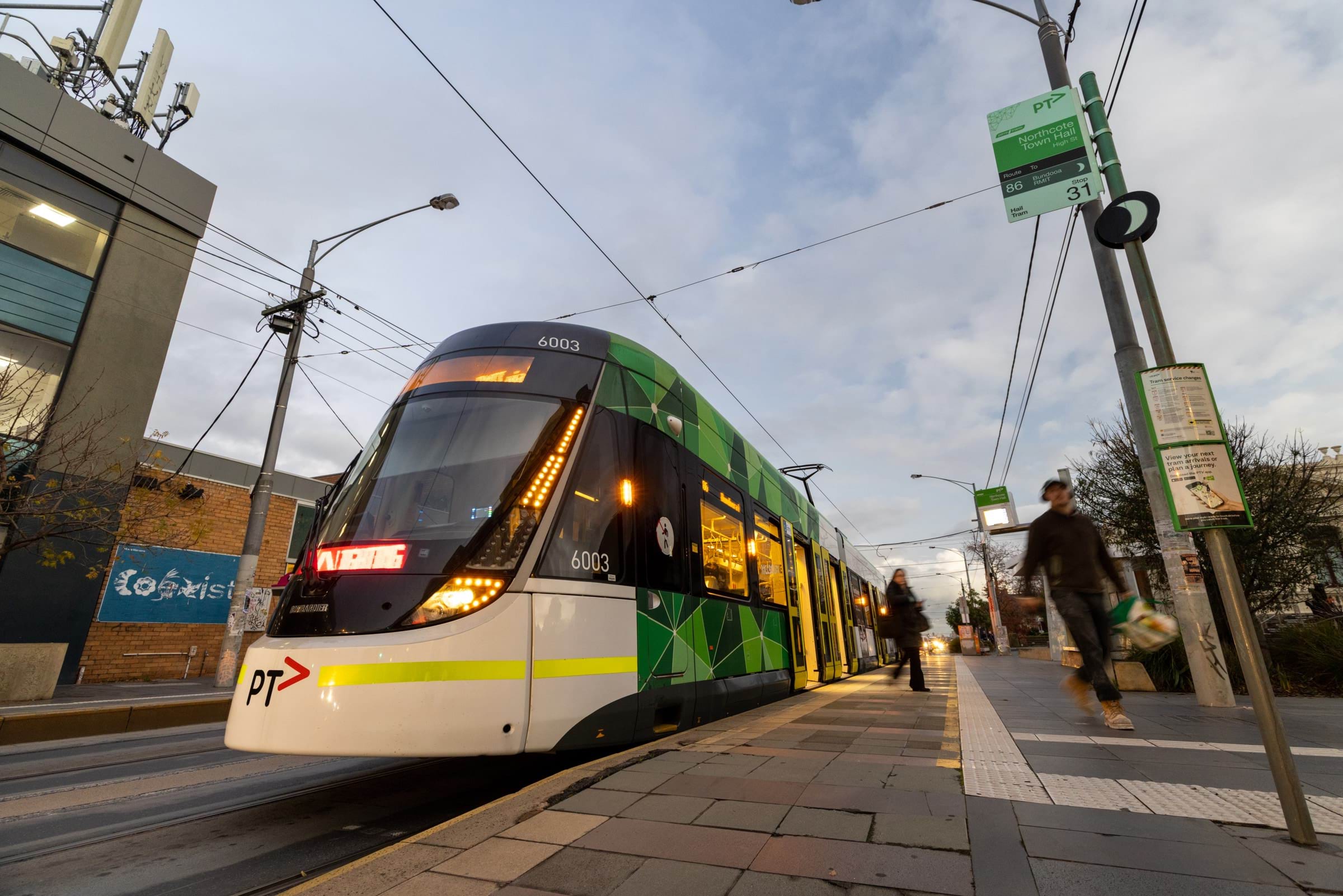 Image of an E Class Tram at a level access tram stop in Melbourne.