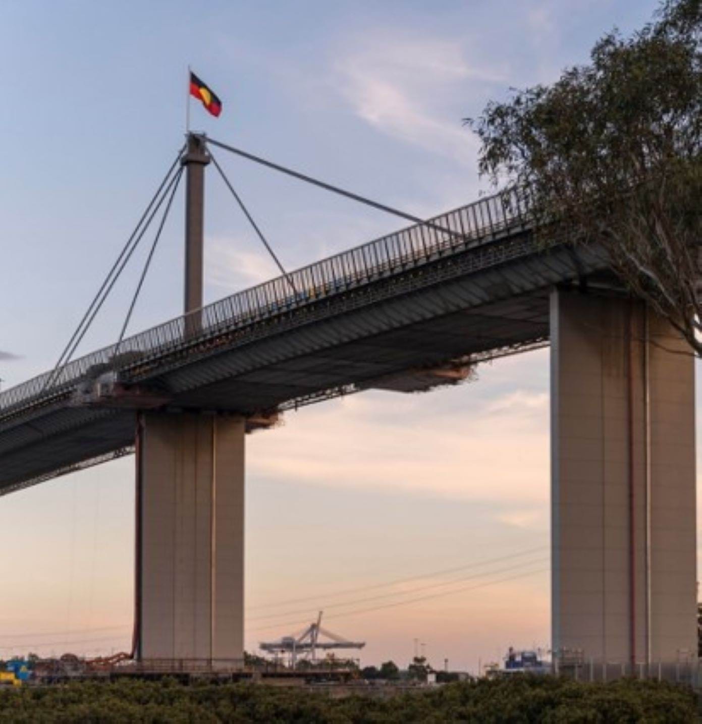 Image of the Aboriginal Flag flying permanently on the West Gate Bridge