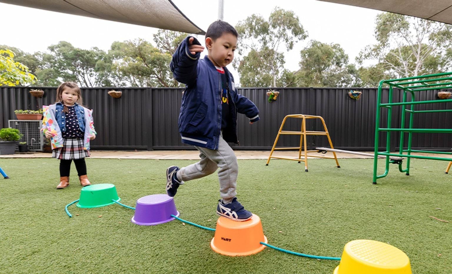 A child playing on a balancing equipment