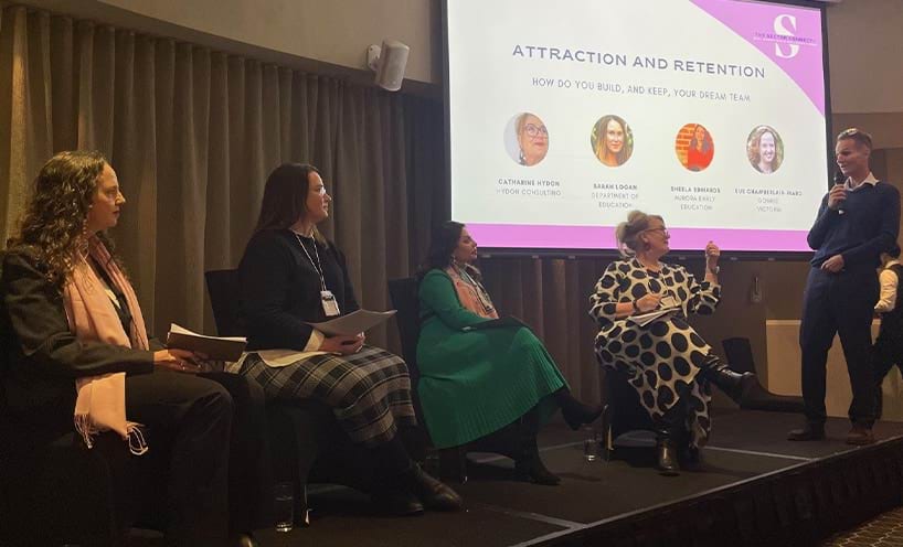 Panellists in conversation on the stage
