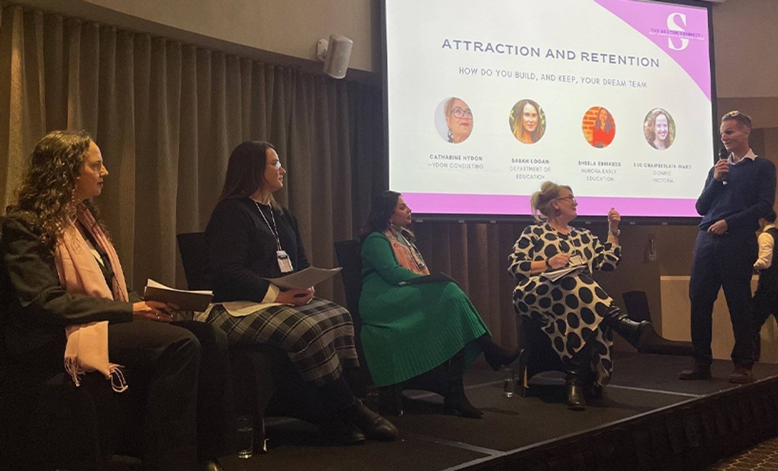 Panellists in conversation on the stage