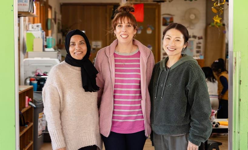 3 educators smiling