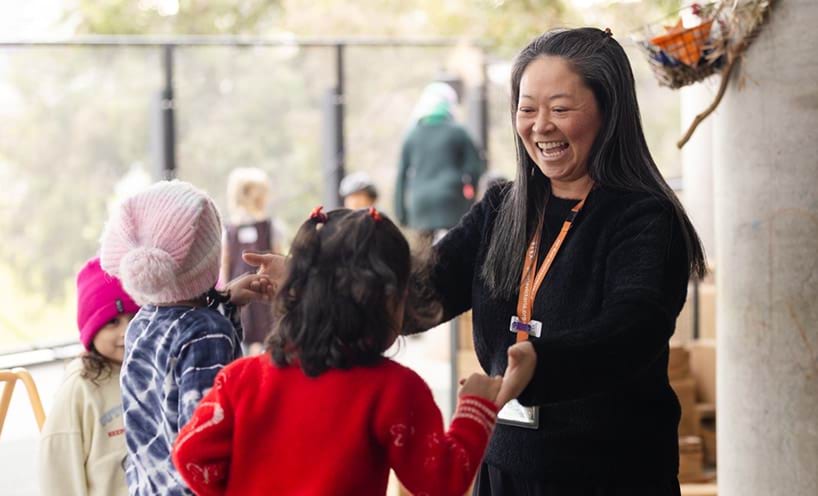 An educator playing with the children