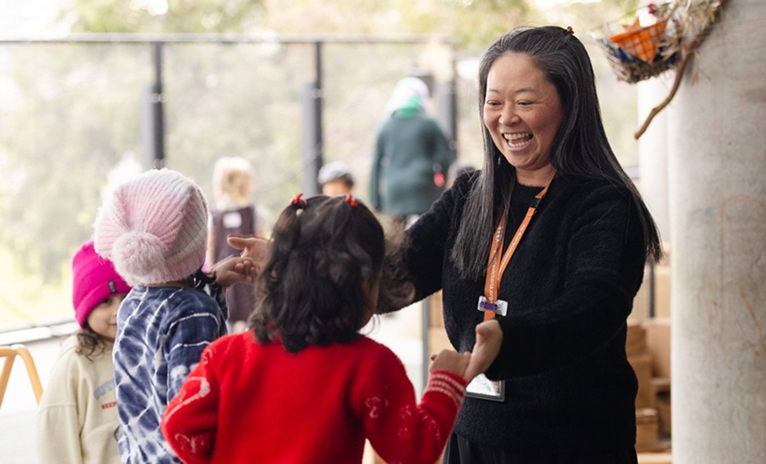 An educator playing with the children