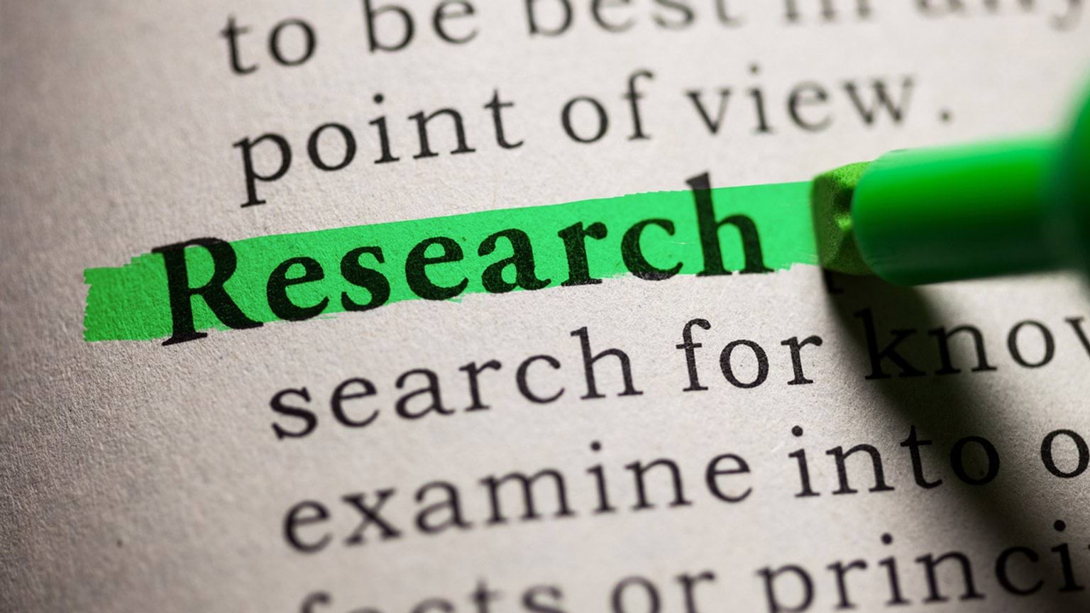 The word 'Research' highlighted in a dictionary