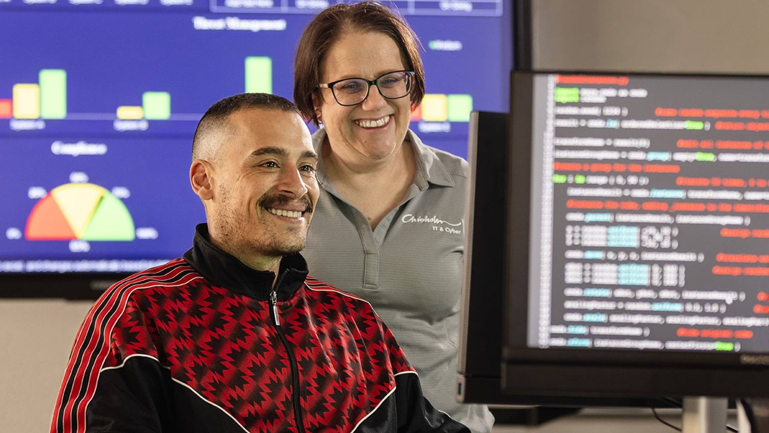 Student and teacher looking at a screen in a computer lab - State of the Victorian Labour Market 2025 cover