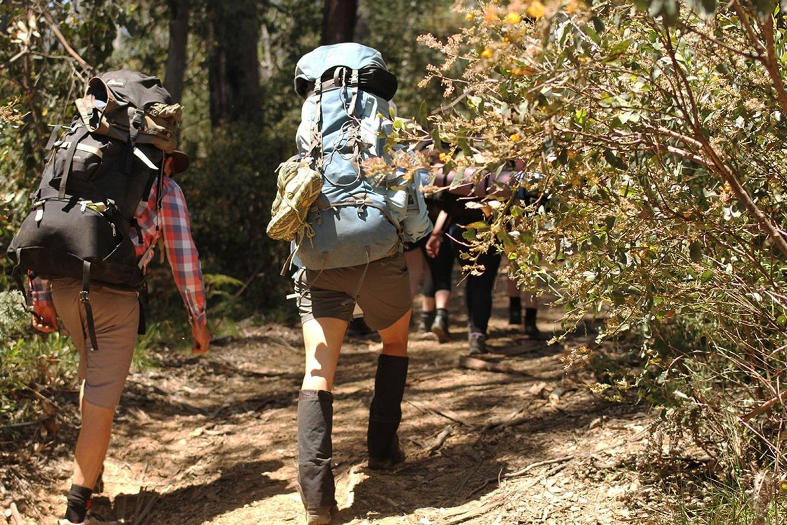student and teacher hiking on a trip