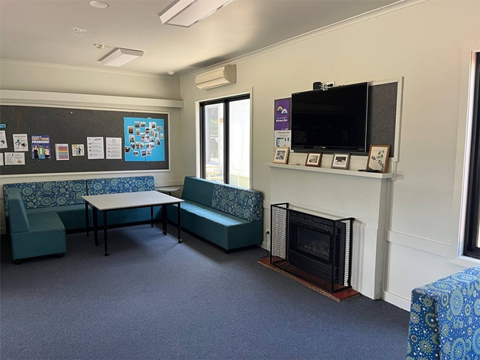 A television, table, and heater is shown.