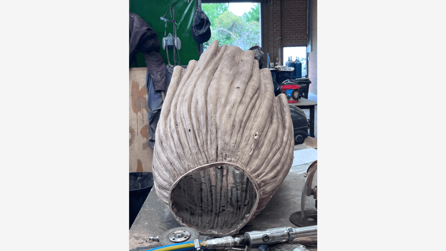 Barbara Rae sculpture bronze skirt on it's side