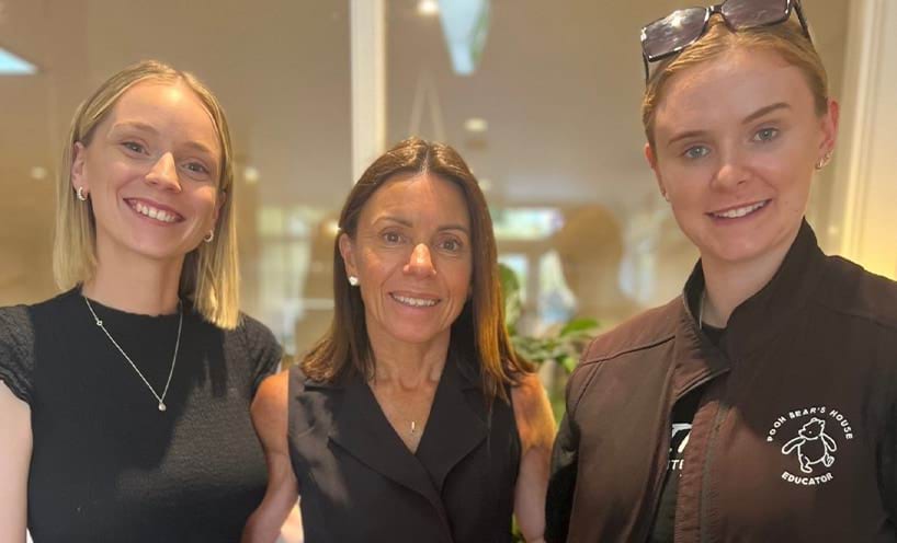 3 people smiling for the camera