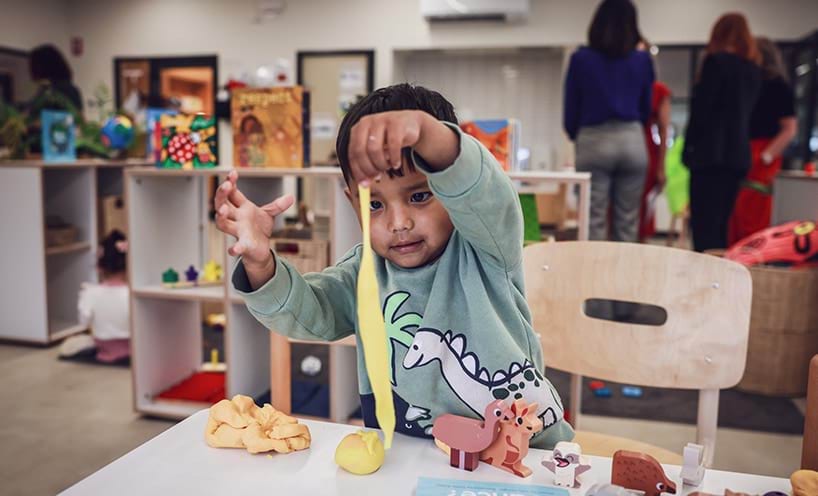 A child playing with play dough
