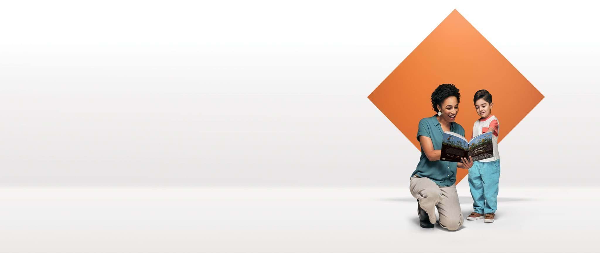 An early childhood teacher reads with a child in front of an orange diamond floating in white space.