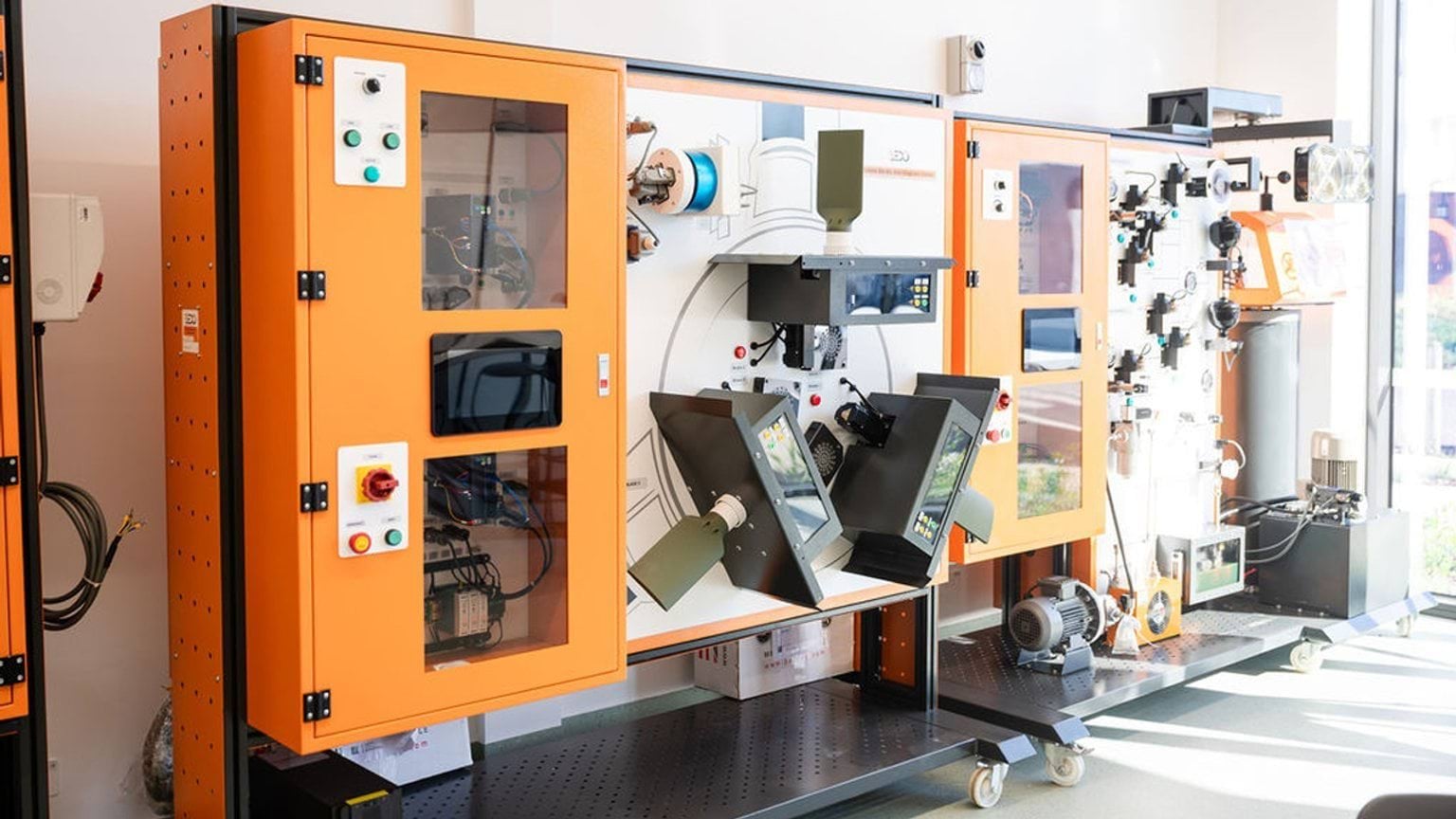 Industrial training equipment setup with electrical control cabinets used for hands on technical training at the Clean energy centre.