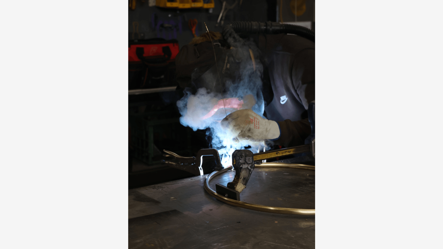 Artist welding sculpture, Binak Ngarrgu, Basket of Knowledge