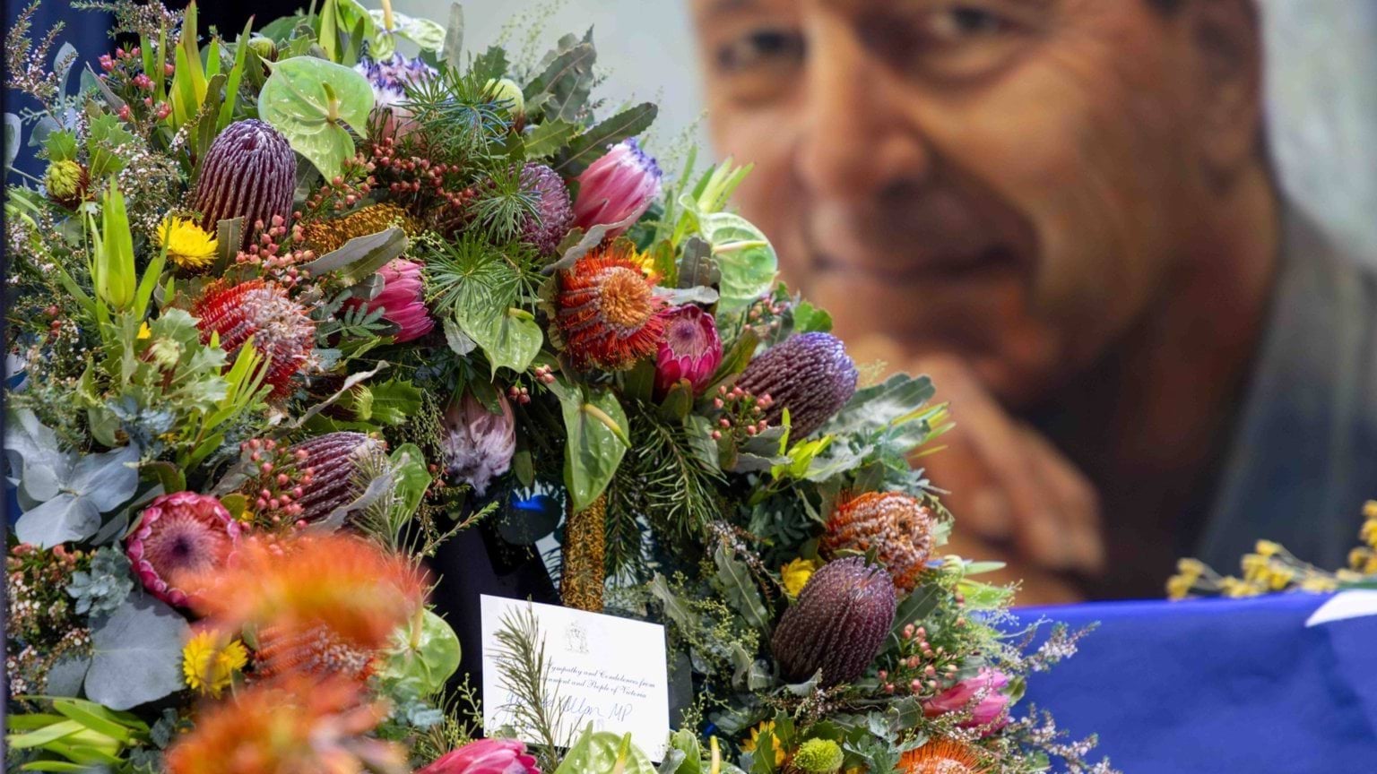 Neale Daniher AO State Funeral Service Wreath with a card signed by Premier Jacinta Allan