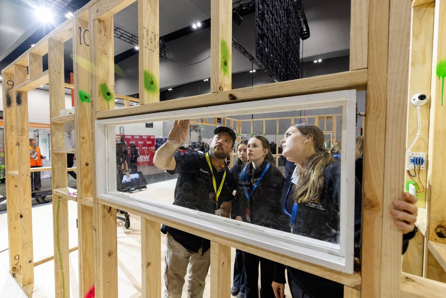 Female students learning about window frame insertion