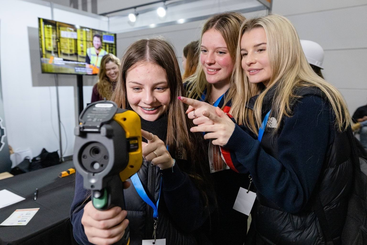 Female students testing surveying equipment