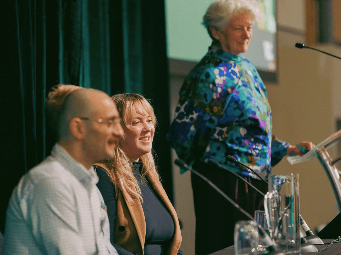 Panellists talking at an event