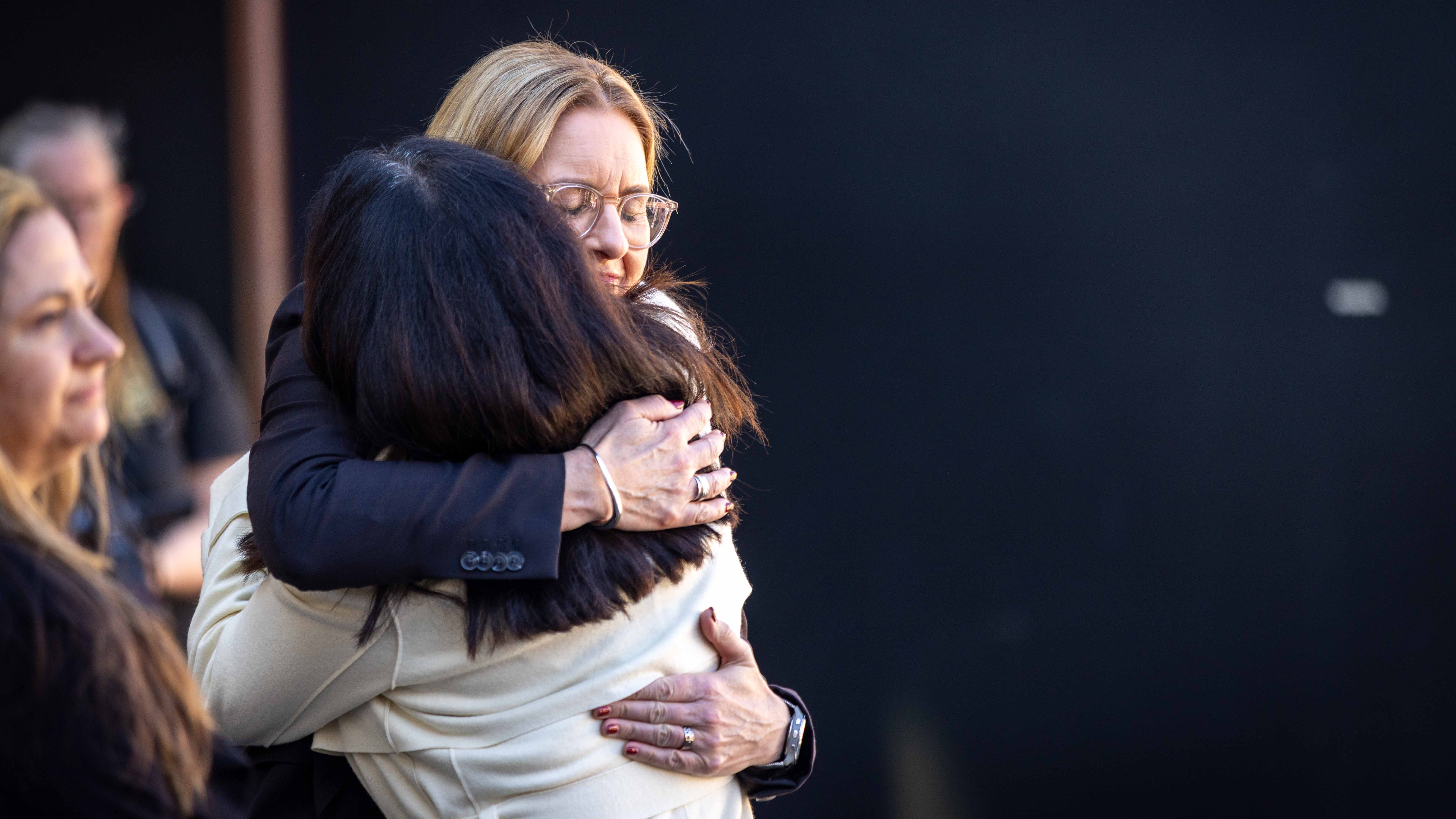 Russell's daughter Anita is greeted and embraced by Hon Jacinta Allan MP