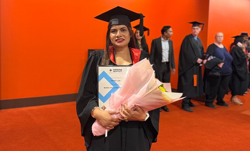 Rashmin Luitel with flowers and Certificate.