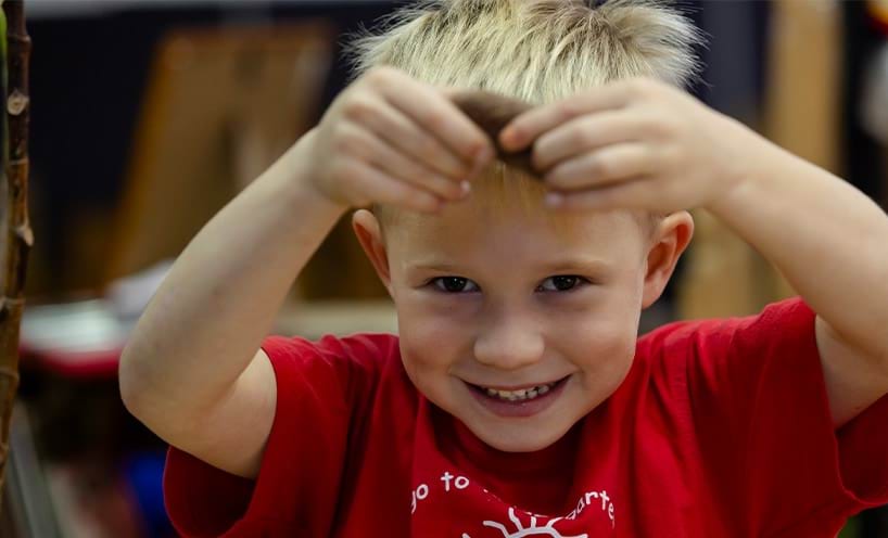 A boy with light blonde hair.